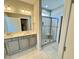Bathroom featuring shaker cabinets, double vanity, and glass enclosed shower at 1056 Fairhaven Dr # 97, Mebane, NC 27302