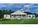 Inviting exterior elevation featuring stone accents, white trim, and a well-manicured lawn at 1056 Fairhaven Dr # 97, Mebane, NC 27302