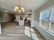 View of the open floor plan, kitchen, breakfast nook, and living room with lots of light at 1056 Fairhaven Dr # 97, Mebane, NC 27302