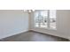 Bright dining area features natural light, wood flooring, and a stylish chandelier at 1237 Jasmine View Way, Knightdale, NC 27545