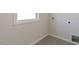 The laundry room features tile flooring, a window and includes essential hookups at 1237 Jasmine View Way, Knightdale, NC 27545
