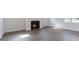 Cozy living room showcasing a fireplace with natural light and hard wood flooring at 1237 Jasmine View Way, Knightdale, NC 27545