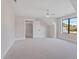 Bright bedroom with carpet flooring, large window, and ceiling fan at 1886 Mays Crossroad Rd, Louisburg, NC 27549