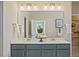 Modern bathroom with double sink vanity, quartz countertop, and designer light fixtures at 512 Lemon Daisy Ln, Knightdale, NC 27545