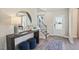 Welcoming foyer with a staircase, console table with décor, and natural light from the front door at 512 Lemon Daisy Ln, Knightdale, NC 27545