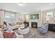 Inviting living room with a fireplace, elegant decor, and comfortable seating arrangement at 512 Lemon Daisy Ln, Knightdale, NC 27545