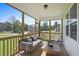 Inviting screened porch features outdoor seating with views of the landscaped backyard at 512 Lemon Daisy Ln, Knightdale, NC 27545