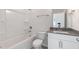 Bright bathroom with a white vanity, soaking tub and shower with chrome fixtures at 524 Lemon Daisy Ln, Knightdale, NC 27545