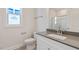 Modern bathroom with neutral walls, gray countertop, and glass-enclosed shower at 524 Lemon Daisy Ln, Knightdale, NC 27545