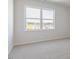 Serene bedroom with a large window and scenic views, creating a relaxing and bright atmosphere at 524 Lemon Daisy Ln, Knightdale, NC 27545