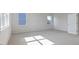Bright bedroom featuring large windows, carpet flooring, and white walls, perfect for relaxation and personalization at 524 Lemon Daisy Ln, Knightdale, NC 27545