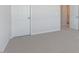 Bedroom featuring neutral walls, plush carpet, and an open doorway, creating a comfortable and inviting space at 524 Lemon Daisy Ln, Knightdale, NC 27545