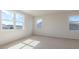 Empty bedroom with carpet, and multiple windows at 524 Lemon Daisy Ln, Knightdale, NC 27545