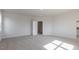 Spacious carpeted bedroom with ample natural light and an open doorway, offering a bright and airy feel at 524 Lemon Daisy Ln, Knightdale, NC 27545