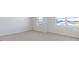Bedroom with carpet, natural light, and two windows showing the surrounding neighborhood at 524 Lemon Daisy Ln, Knightdale, NC 27545