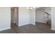Open dining room with hardwood floors leading to stairs and other rooms at 524 Lemon Daisy Ln, Knightdale, NC 27545