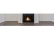 Close up view of a fireplace with dark wood floors at 524 Lemon Daisy Ln, Knightdale, NC 27545