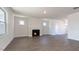Spacious living room with fireplace, hardwood floors, and ample natural light at 524 Lemon Daisy Ln, Knightdale, NC 27545