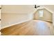 Spacious attic featuring hardwood floors, a ceiling fan and a window at 205 Red Cardinal Ct, Youngsville, NC 27596