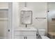 Modern bathroom features white vanity, marble countertop, and sleek black hardware at 205 Red Cardinal Ct, Youngsville, NC 27596