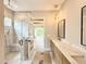 Modern bathroom features double sink vanity, walk-in shower with glass door, and decorative lighting at 205 Red Cardinal Ct, Youngsville, NC 27596