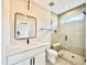 Modern bathroom with marble vanity, glass-enclosed shower, and sleek black fixtures at 205 Red Cardinal Ct, Youngsville, NC 27596