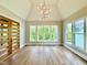 Bedroom with vaulted ceilings, hardwood floors, ample natural light, and modern wood doors at 205 Red Cardinal Ct, Youngsville, NC 27596