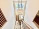 Grand 2-story entryway featuring a modern chandelier, wood door, and staircase with iron railings at 205 Red Cardinal Ct, Youngsville, NC 27596