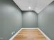Small empty room with hardwood floors and light green walls, ready for customization at 205 Red Cardinal Ct, Youngsville, NC 27596