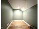 Empty storage room with hardwood floors and clean neutral walls at 205 Red Cardinal Ct, Youngsville, NC 27596