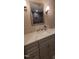 Bathroom vanity featuring gray cabinets, light countertop, and a large mirror at 7610 Buckhorn Rd, Hillsborough, NC 27278