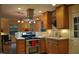 Updated kitchen with stainless steel appliances, stone countertops, and ample cabinet space at 7610 Buckhorn Rd, Hillsborough, NC 27278