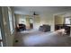 Spacious living room with neutral carpet, bright windows, and an office space at 7610 Buckhorn Rd, Hillsborough, NC 27278