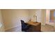 Neutral office space featuring a wooden desk and chair, ideal for a home office setup at 7610 Buckhorn Rd, Hillsborough, NC 27278