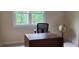 Bright home office space with a large window and a classic globe accent at 7610 Buckhorn Rd, Hillsborough, NC 27278