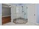 Bathroom features a large walk-in shower with glass enclosure at 6720 Fawn Hoof Trl, Holly Springs, NC 27540