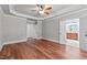 Spacious bedroom with hardwood floors and access to a private bathroom at 6720 Fawn Hoof Trl, Holly Springs, NC 27540