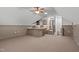Spacious bonus room with wet bar and carpeted floor at 6720 Fawn Hoof Trl, Holly Springs, NC 27540