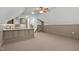 Bonus room features a wet bar and carpeted floors at 6720 Fawn Hoof Trl, Holly Springs, NC 27540
