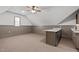 Bonus room with wet bar, carpeted floors, and ceiling fan at 6720 Fawn Hoof Trl, Holly Springs, NC 27540