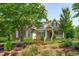 Two story house exterior with front porch and landscaping at 6720 Fawn Hoof Trl, Holly Springs, NC 27540