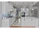 Spacious kitchen with white cabinets, stainless steel appliances, and a large island at 6720 Fawn Hoof Trl, Holly Springs, NC 27540