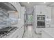 Chic kitchen boasting stainless steel appliances and a blue tile backsplash at 6720 Fawn Hoof Trl, Holly Springs, NC 27540