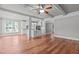 Open kitchen features white cabinets, island, and stainless steel appliances at 6720 Fawn Hoof Trl, Holly Springs, NC 27540
