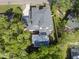 This aerial view showcases the beautiful home, pool, and lush landscaping at 712 Daniels St, Raleigh, NC 27605