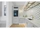 A beverage center features a wine refrigerator, custom shelving and marble counters at 712 Daniels St, Raleigh, NC 27605