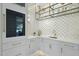 The bar area includes a sink, cabinets, and open display shelving at 712 Daniels St, Raleigh, NC 27605