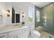 Elegant bathroom with glass enclosed shower, luxurious countertops and gold fixtures at 712 Daniels St, Raleigh, NC 27605