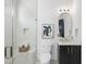 Modern bathroom with a glass shower, marble bench, white toilet, and dark vanity at 712 Daniels St, Raleigh, NC 27605