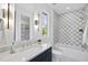 Charming bathroom with tiled shower and tub combination, modern finishes, and ample storage space at 712 Daniels St, Raleigh, NC 27605